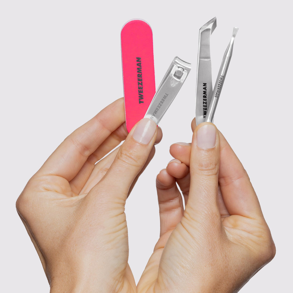 Tweezerman Mini Neon Nail Rescue Kit 3-inch nail file shapes and smooths edges.