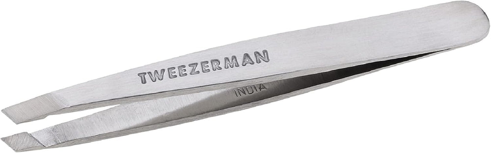 Tweezerman Mini Slant Tweezer closeup with precision tips for root-level hair removal.