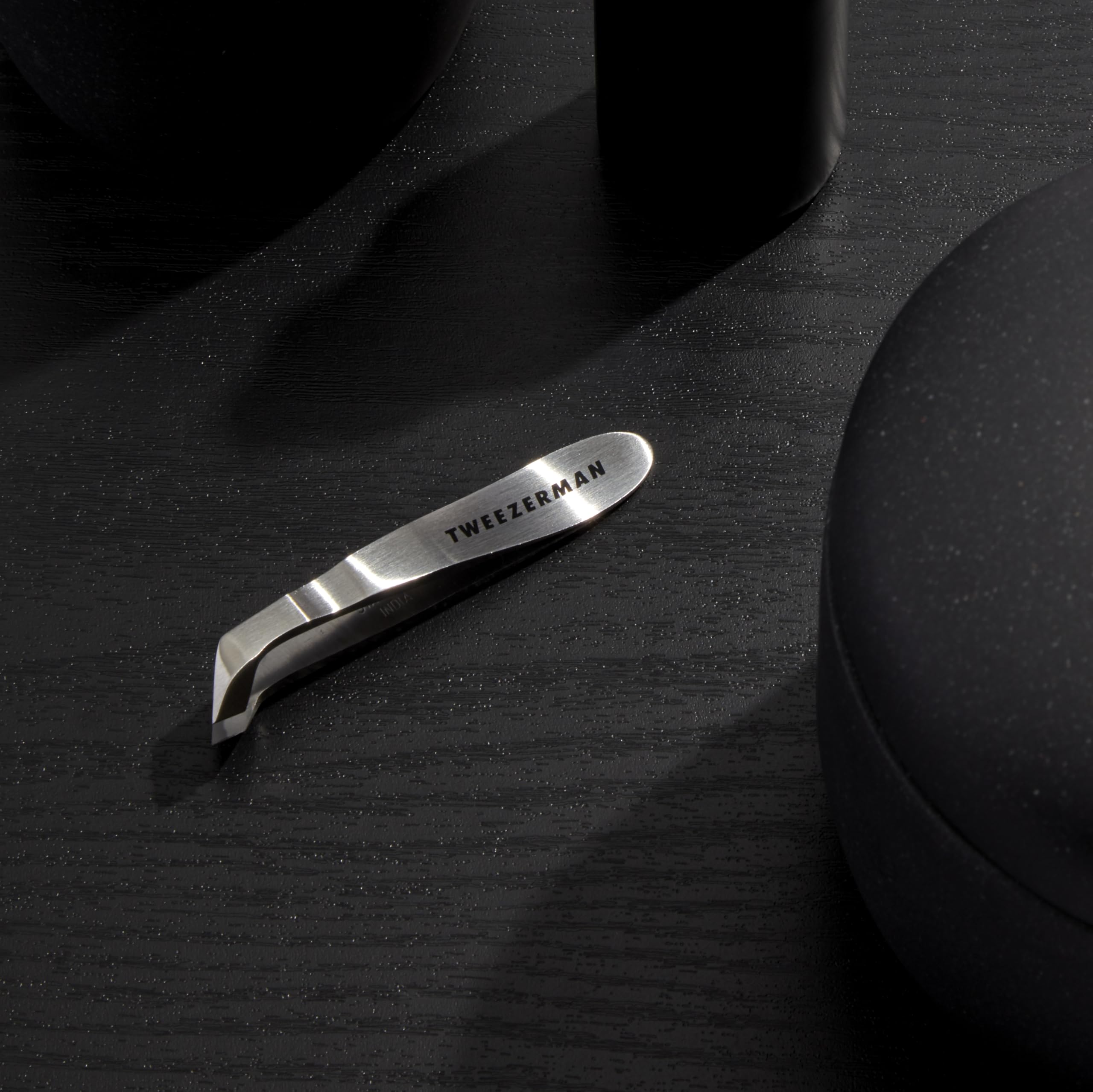 Tweezerman Mini Squeeze Cuticle Nipper in use for precise hangnail trimming.