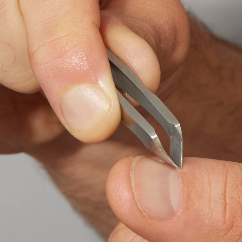 Tweezerman Mini Squeeze Cuticle Nipper close detail of textured near-tip control.