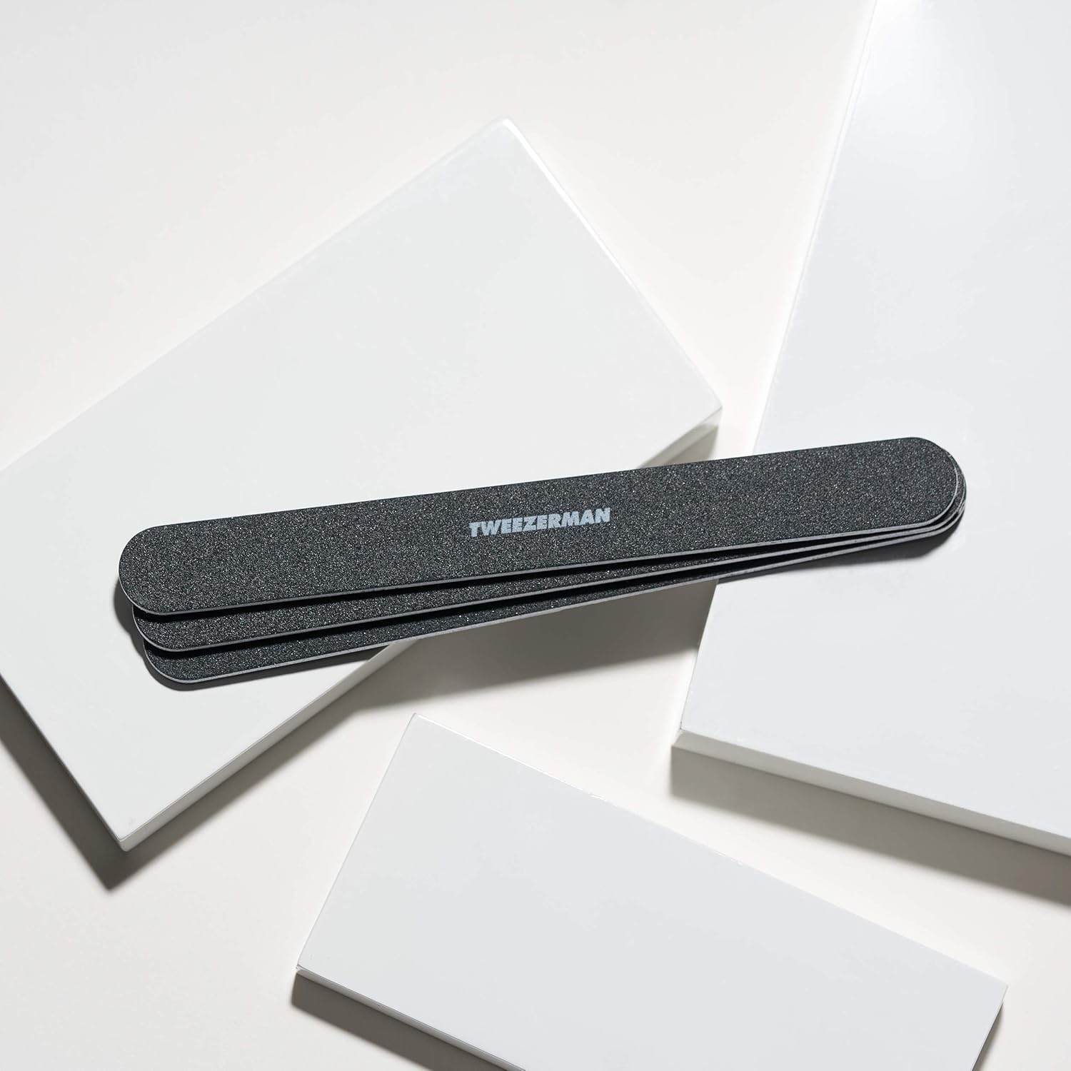 Tweezerman 180-240 grit detail highlights edge shaping and smoothing.
