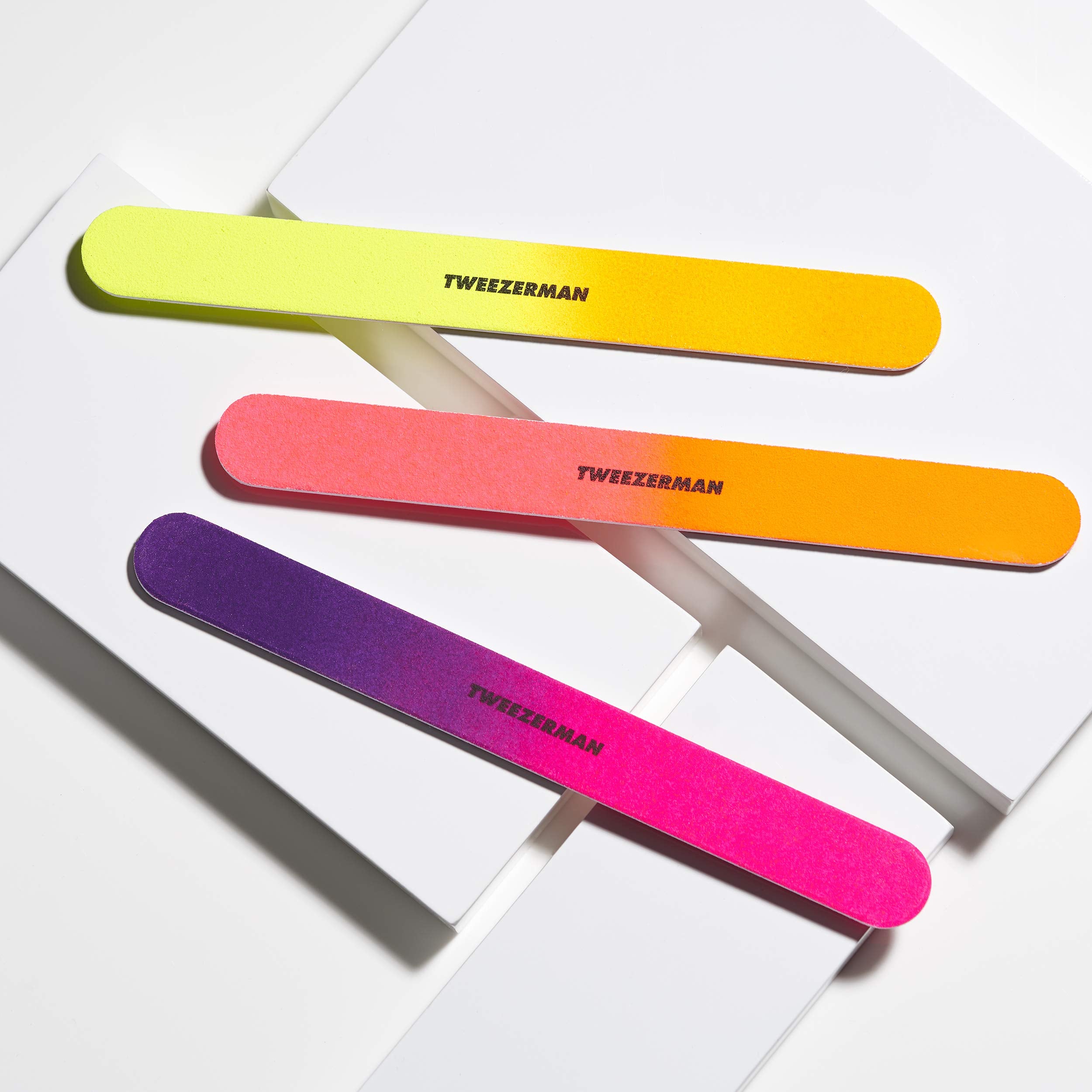 Tweezerman Neon Hot Nail Files in use for quick nail shaping at home.