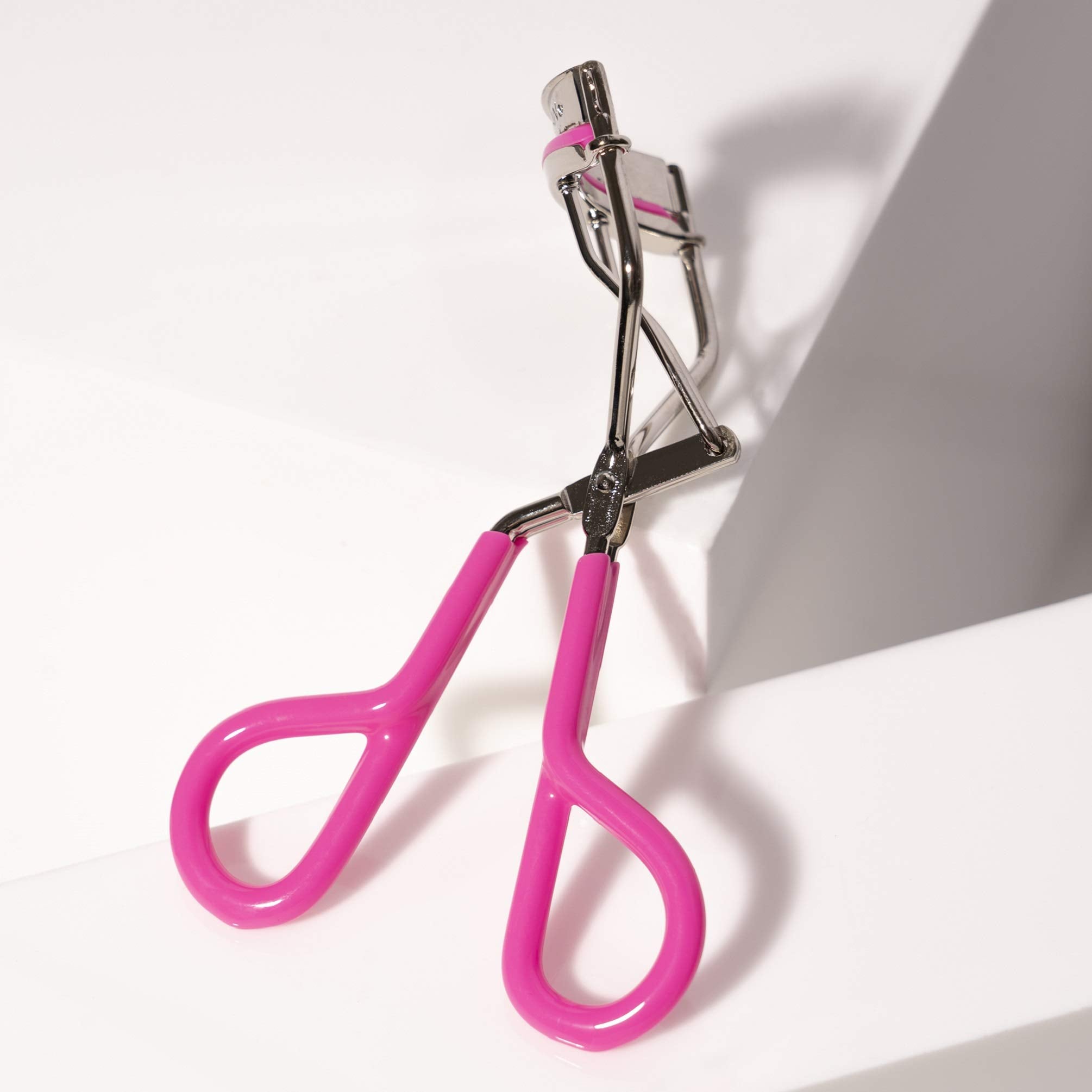 Tweezerman Neon Pink Comfort Grip Eyelash Curler easy to clean with alcohol wipe after use
