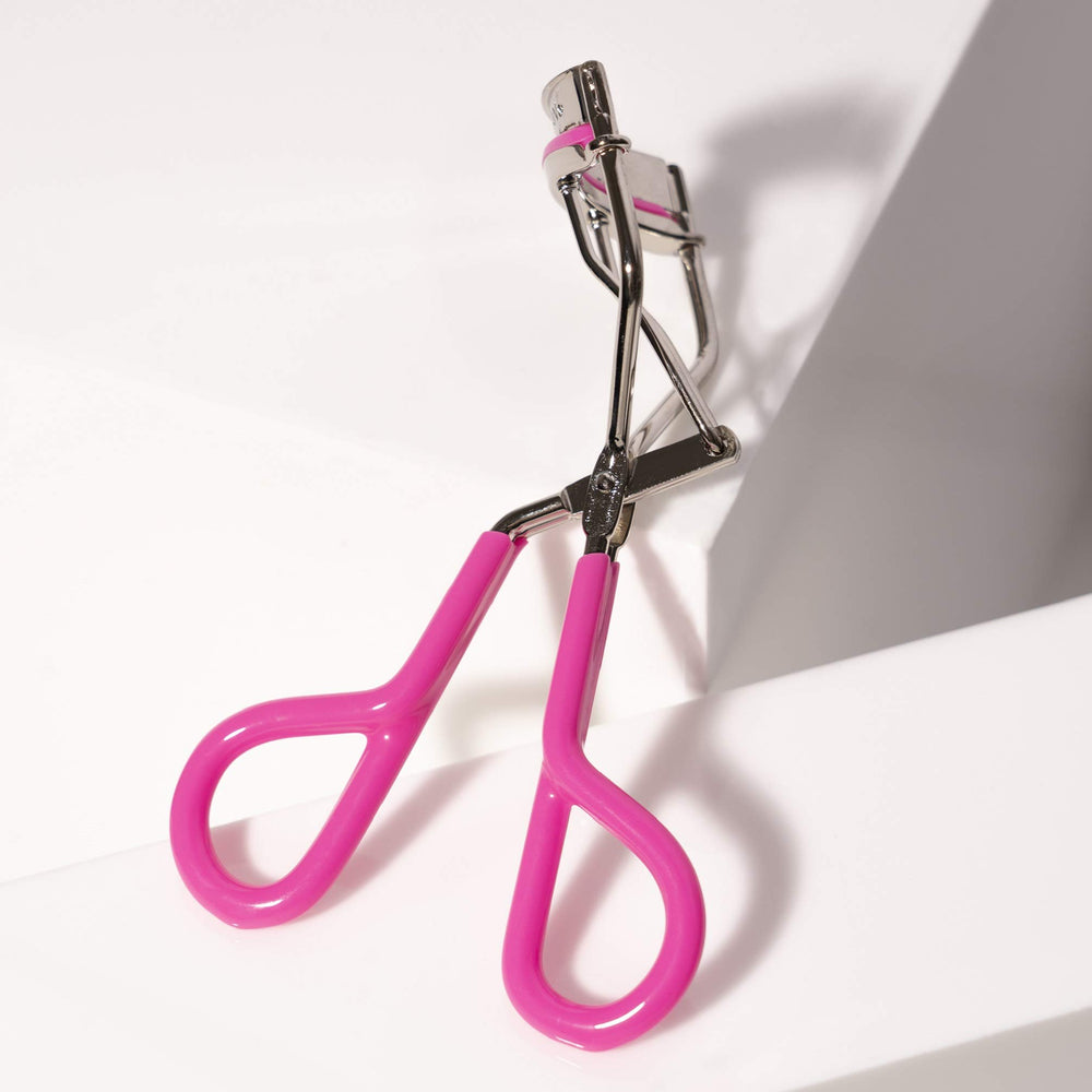 Tweezerman Neon Pink Comfort Grip Eyelash Curler easy to clean with alcohol wipe after use