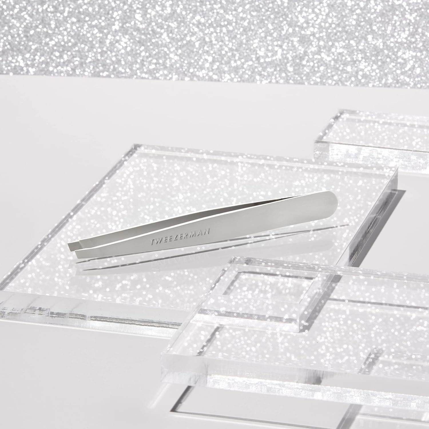 Tweezerman platinum-silver hand grip supports comfortable grooming sessions