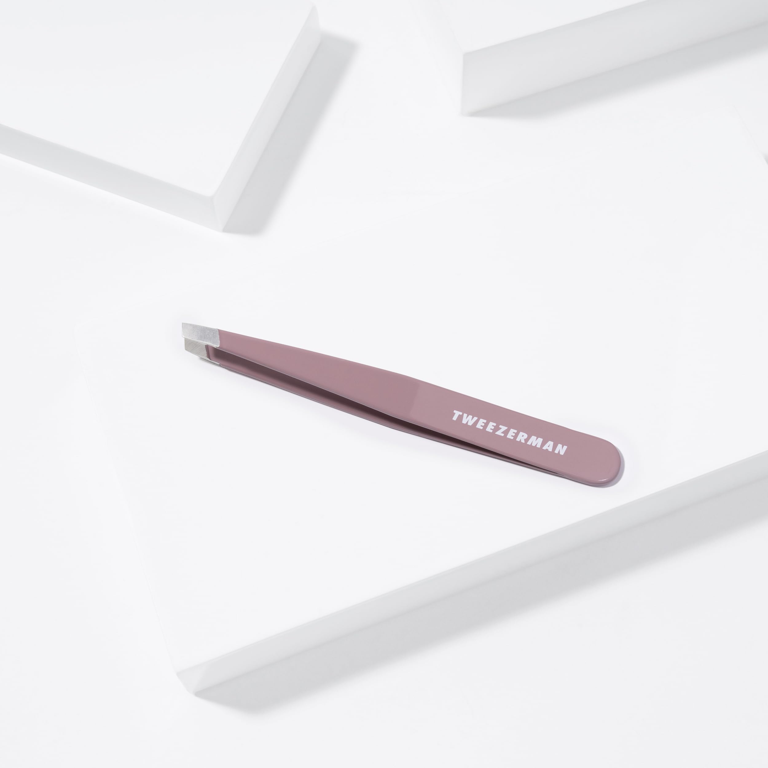 Tweezerman Purple Wisteria Slant Tweezer for professional-grade results at home.