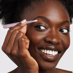 Tweezerman Purple Wisteria Slant Tweezer tips aligned evenly for clean hair removal.