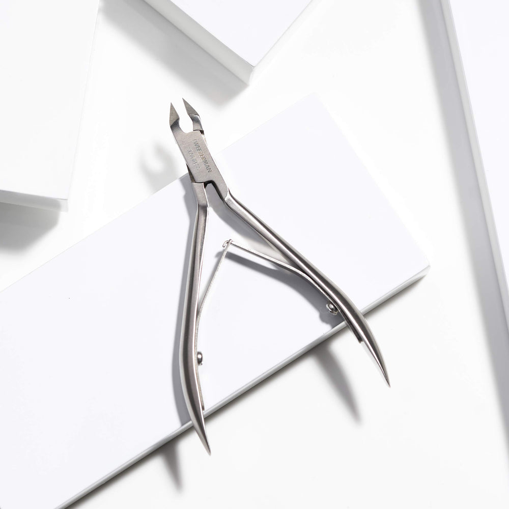Tweezerman Rockhard with cuticle pushy for gentle prep before trimming.