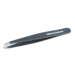 Tweezerman stainless steel slant tweezer with blue stone for precise brow shaping.