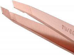 Close-up of Tweezerman rose gold slant tweezer showing aligned tips for one-stroke tweezing