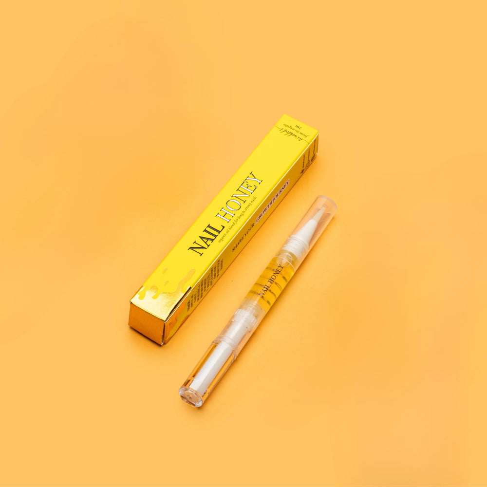 Twinkled T Nail Honey bottle close-up showing organic formula for nail strengthening.