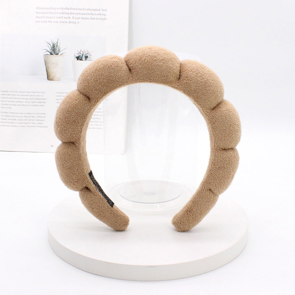 TYSSELY spa headband used during cleansing to keep hair dry and out of the way.