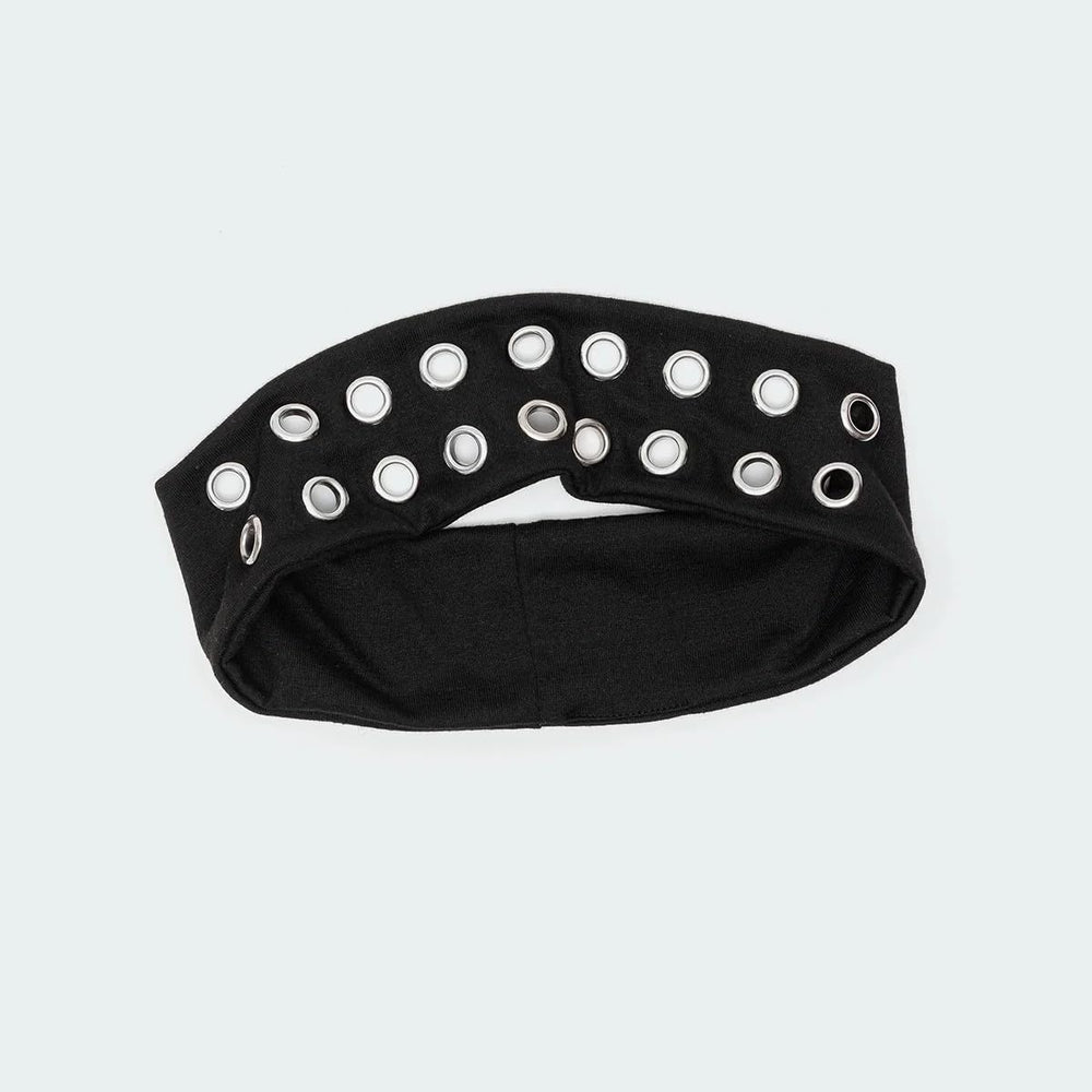 Closeup of metal eyelets on Uchyius grommet headband highlighting durable industrial details