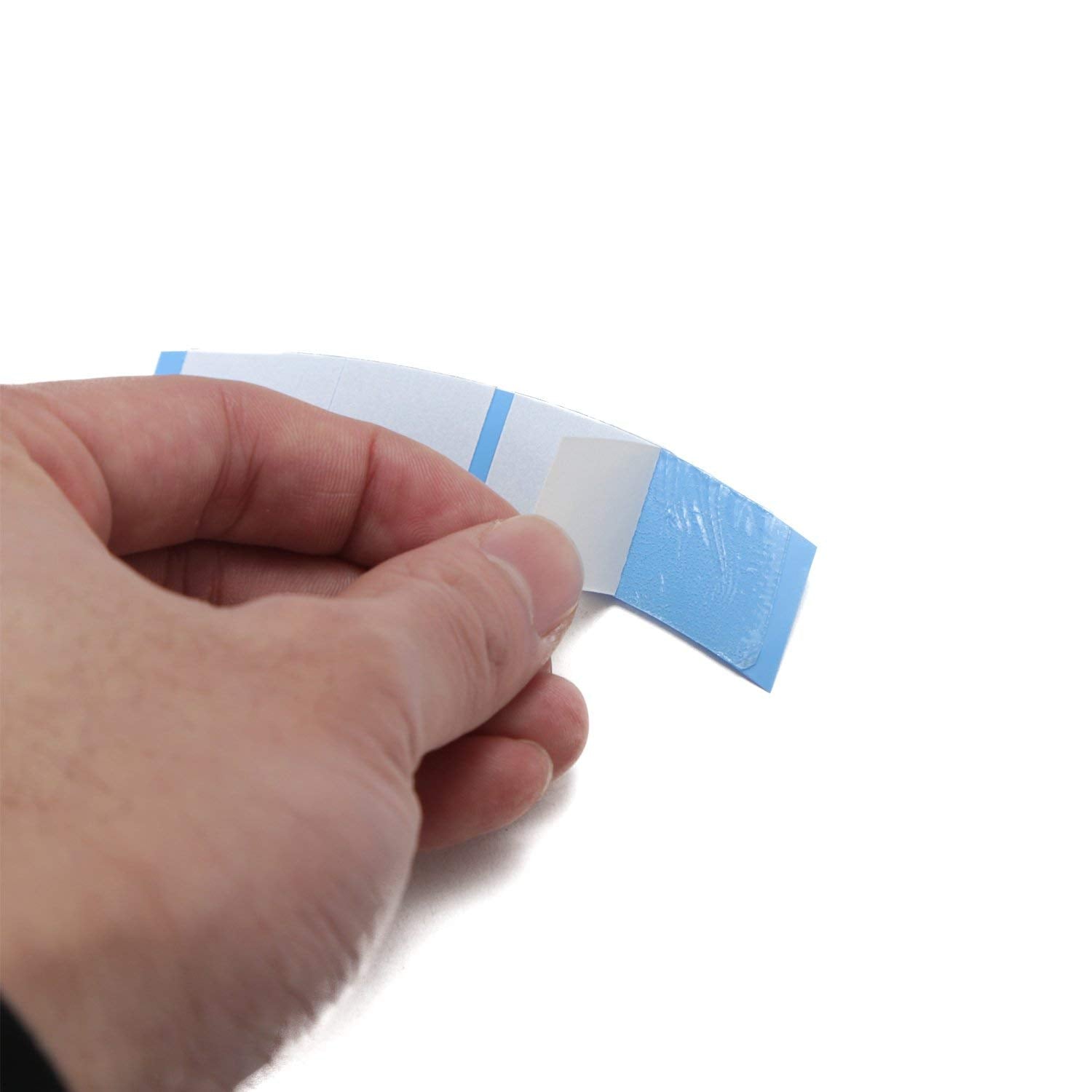 Ultra Hold Minis Tape Tabs on a lace wig for secure fit.