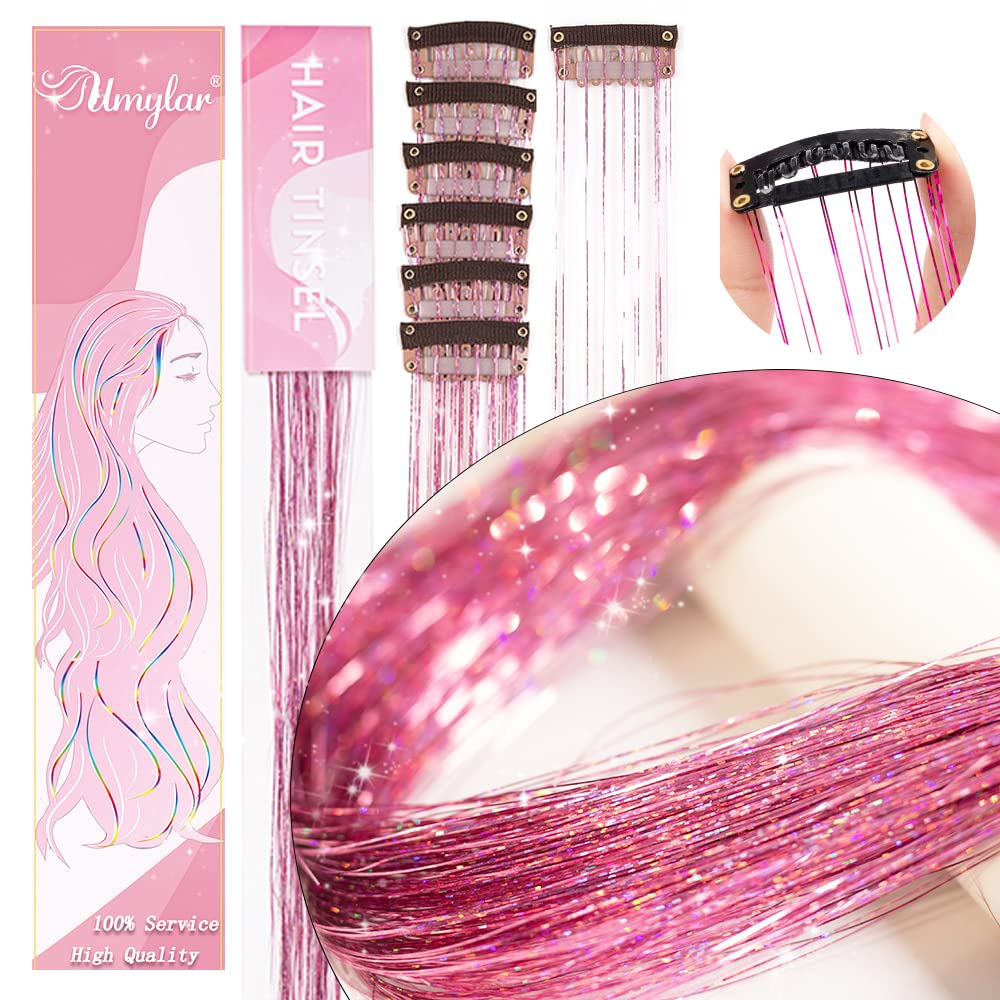 Umylar pink hair tinsel clipped into hair for dramatic shine.