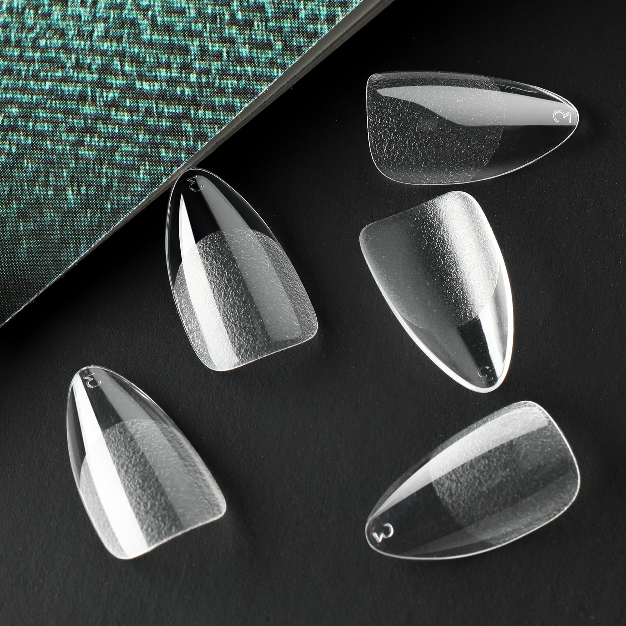 UNA GELLA tips are pre-etched to speed up DIY nail art prep.