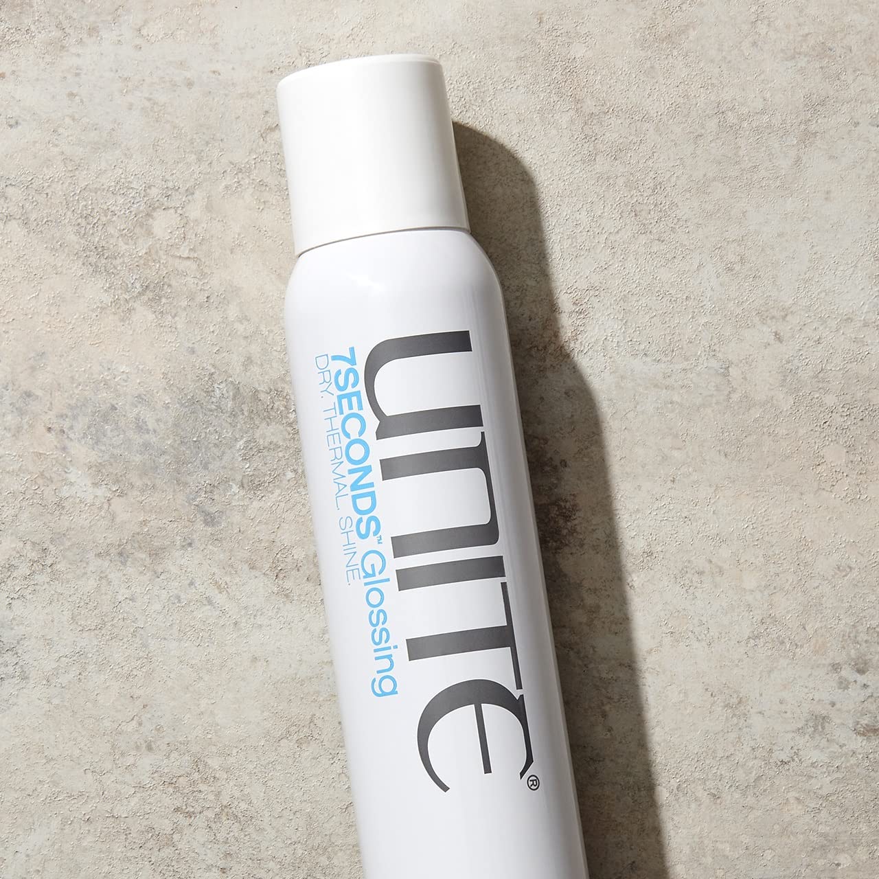 UNITE 7SECONDS Glossing Spray mist conveying light, airy application for smooth hair.