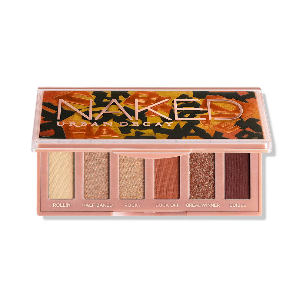Urban Decay Naked Mini Half Baked palette compact case showcasing warm bronze shades for everyday looks.