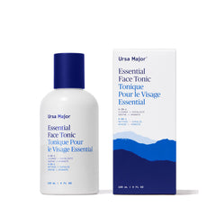 Ursa Major Essential Face Tonic bottle on a bathroom shelf for daily cleansing.