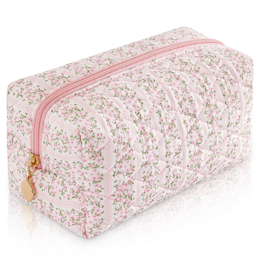 UUYUUY makeup bag with floral quilting in pastel pink, ideal for travel.