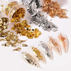 UVANKAUP nail foil flakes gold bottle close-up for shiny nails and crafts.