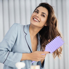 UVZNUMG Curl Defining Brush on dry hair for curl shaping.
