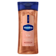 Vaseline Brilloso y Deslumbrante – botella frontal con brillo dorado para piel luminosa.