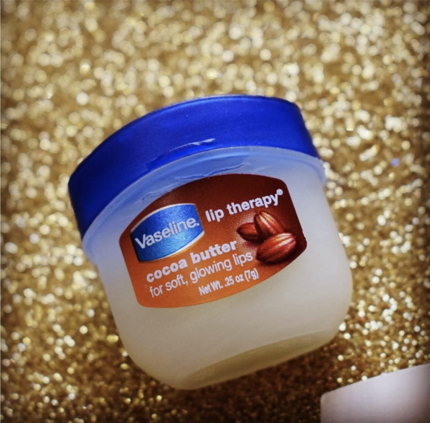 Vaseline Cuidado de Labios Manteca de Cocoa frasco mini, nutrición intensa y sensación suave.