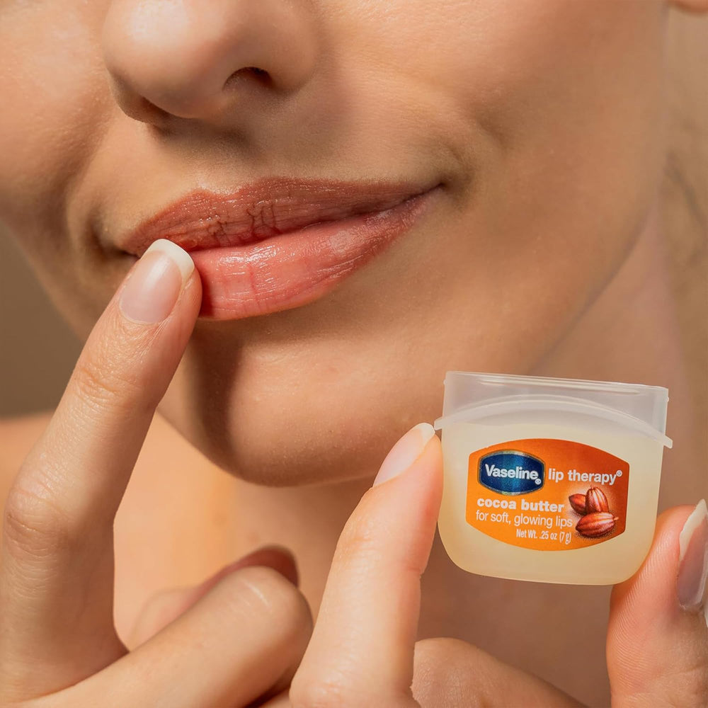 Vaseline Lip Therapy portable case on desk — ready for touch-ups anywhere.