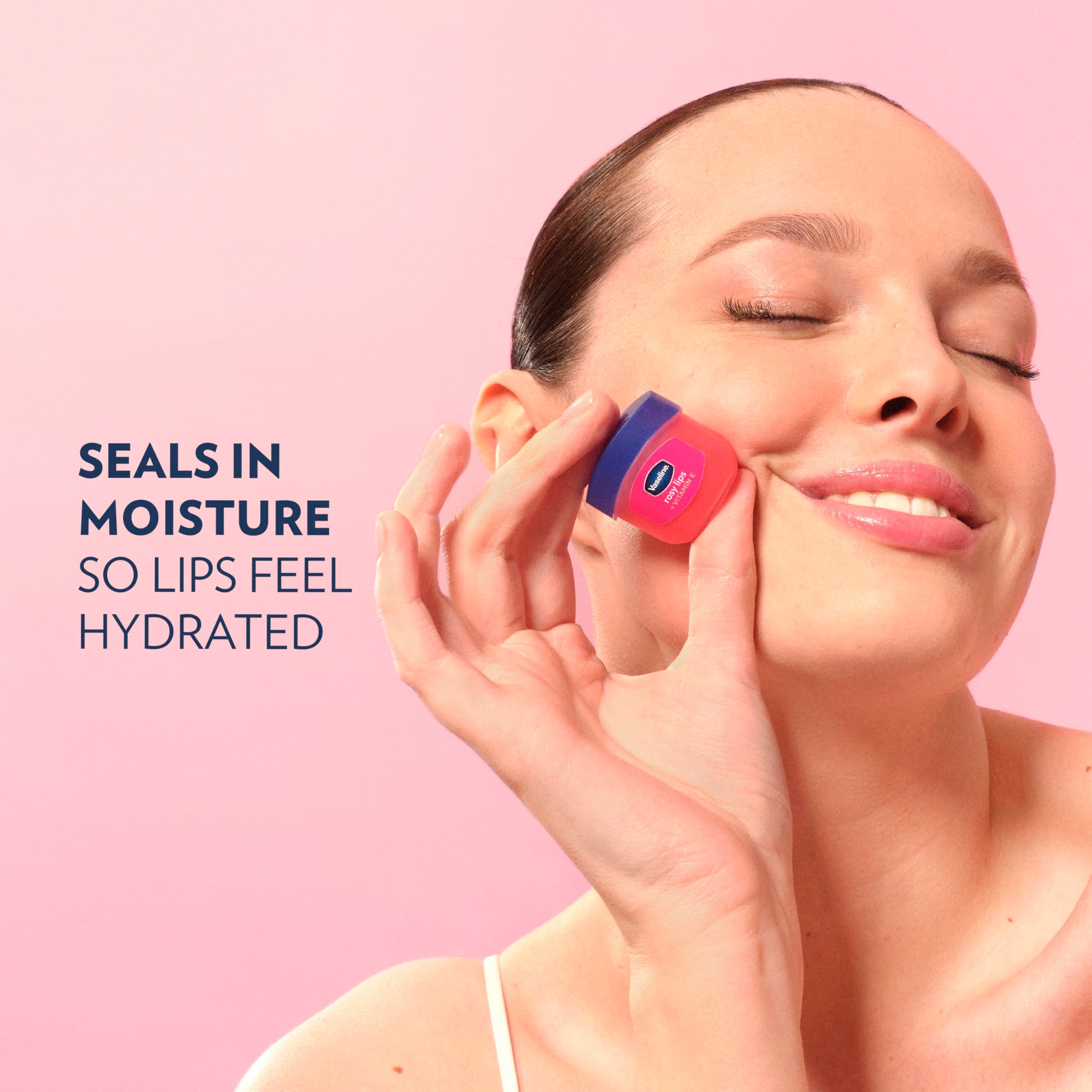 Swatch of Vaseline Lip Therapy Rosy Lips Mini on skin.