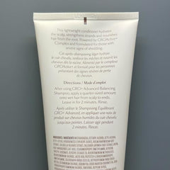 VEGAMOUR GRO+ Advanced Balancing Conditioner texture close-up reveals silky hair.