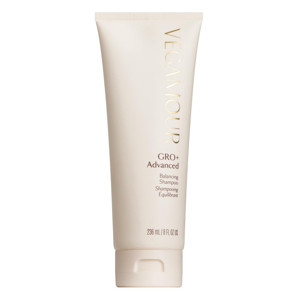 VEGAMOUR GRO+ Balancing Shampoo bottle pouring to cleanse scalp and remove buildup.