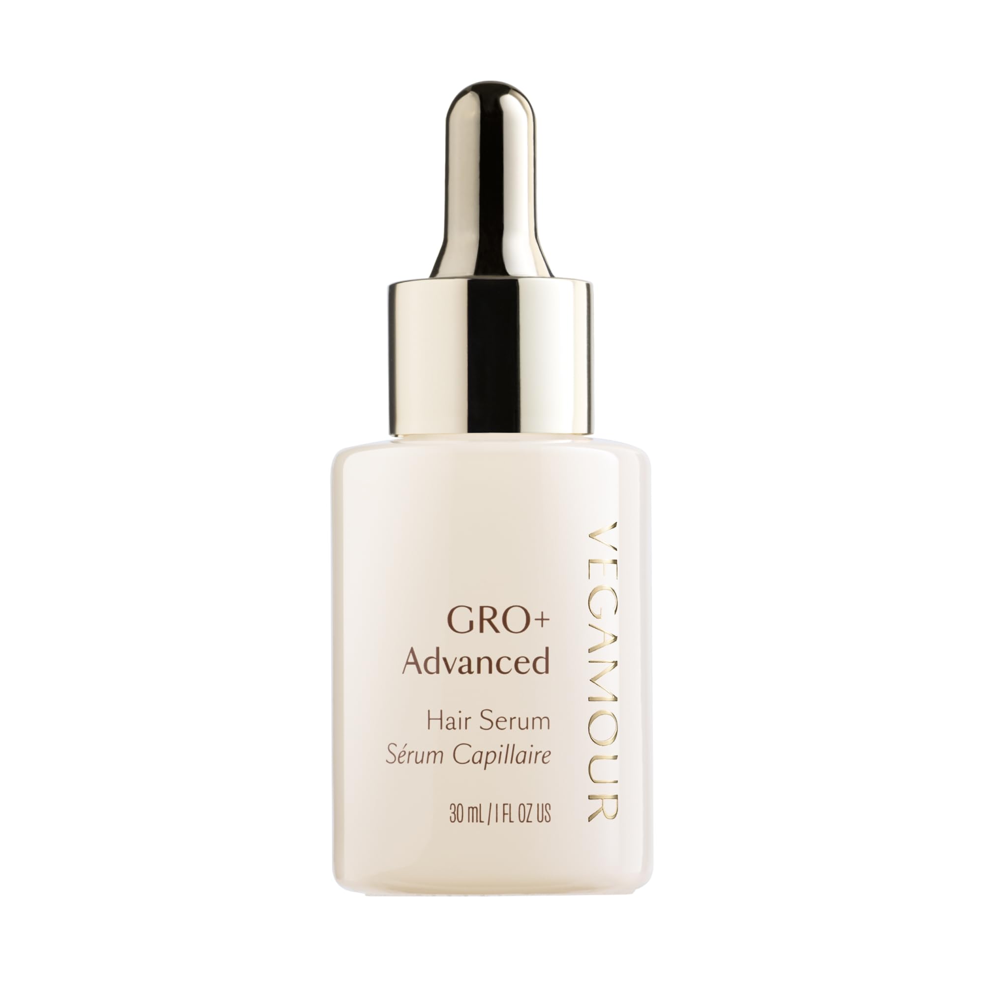 VEGAMOUR GRO+ serum bottle on a bathroom counter for daily scalp nourishment.