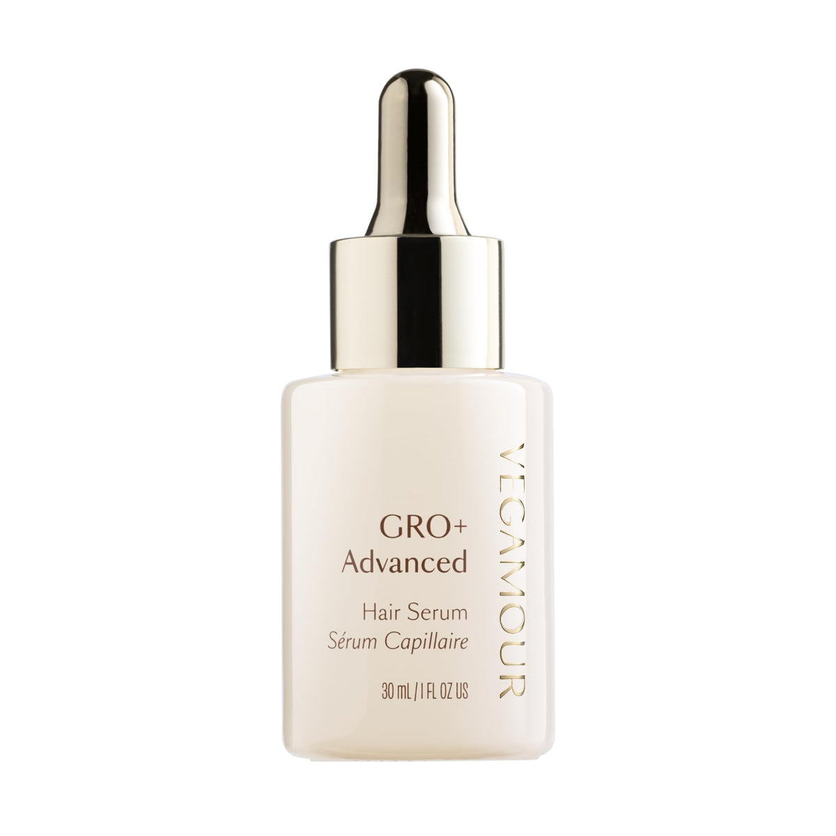 VEGAMOUR GRO+ serum bottle on a bathroom counter for daily scalp nourishment.