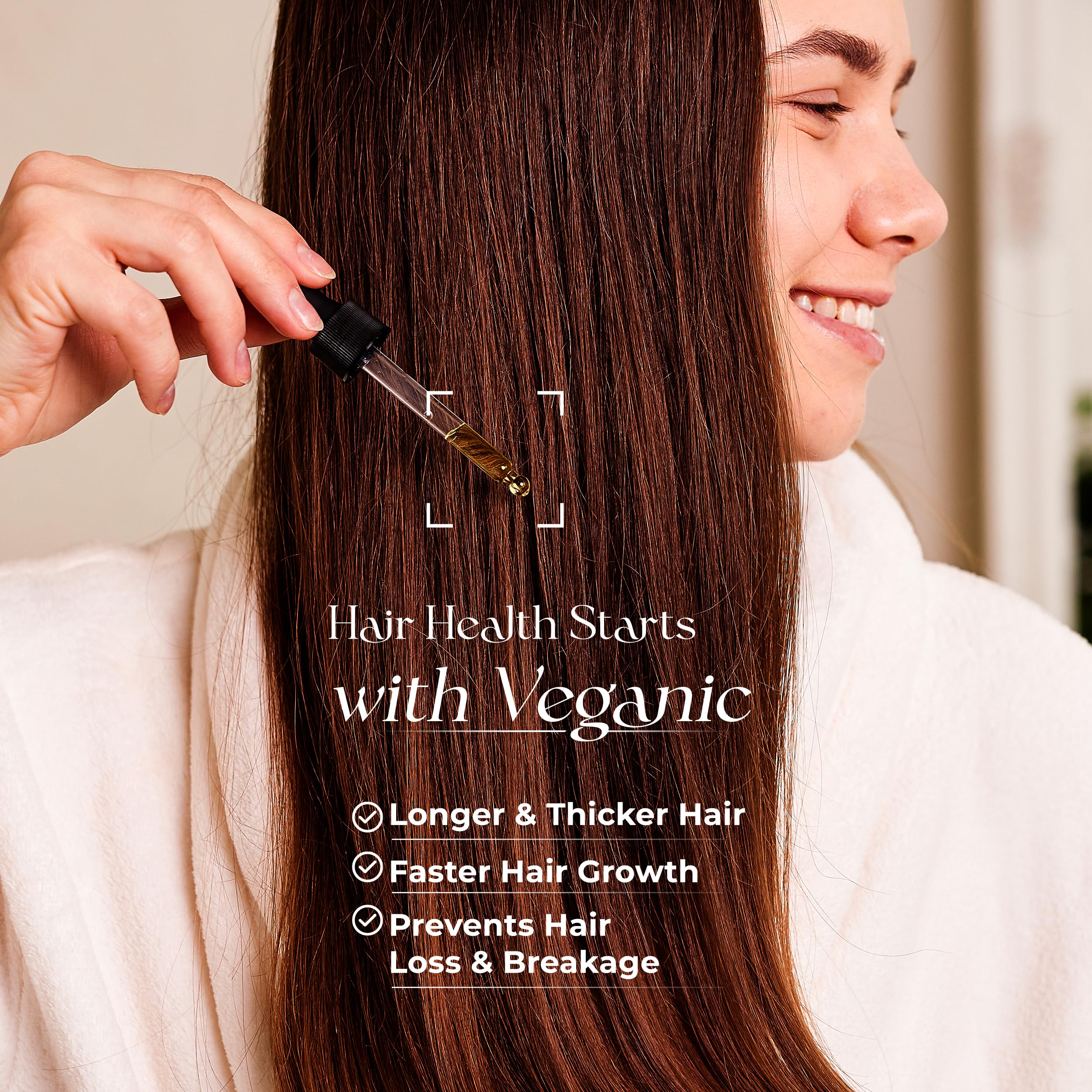 Veganic Natural Hair Growth Oil dropper infusing scalp for renewed growth potential