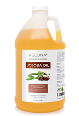 Velona Jojoba Oil gallon bottle close-up, showcasing pure hydration for skin and hair