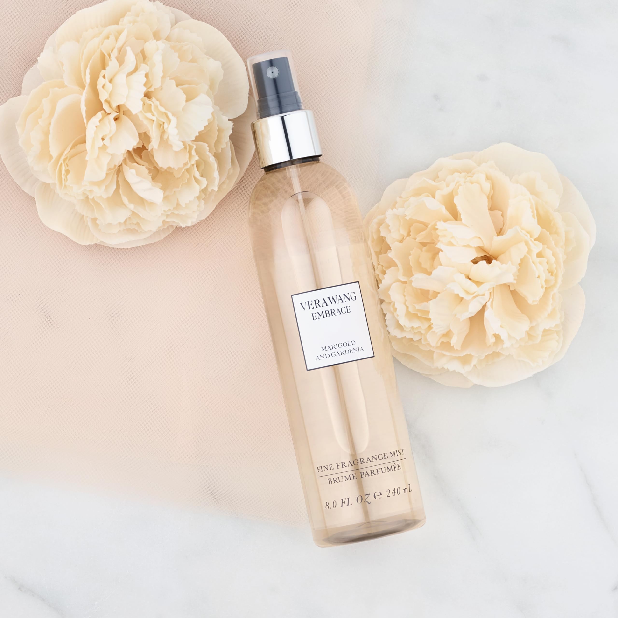 Close-up of the Vera Wang Embrace Merigold & Gardenia label highlighting notes.
