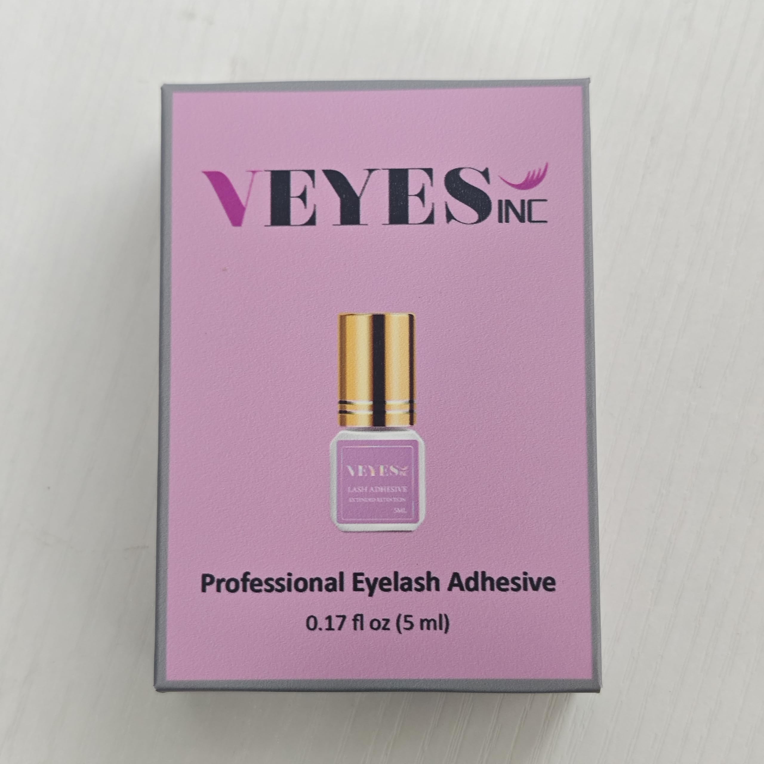 VEYES INC adhesive applicator brush close-up showing precise control.