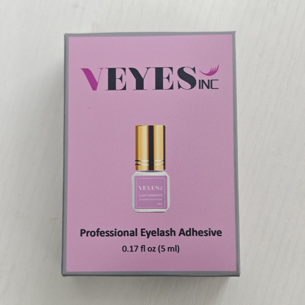 VEYES INC adhesive applicator brush close-up showing precise control.