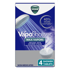Tableta Vicks VapoShower MAX colocada en el suelo de la ducha para vapores calmantes.