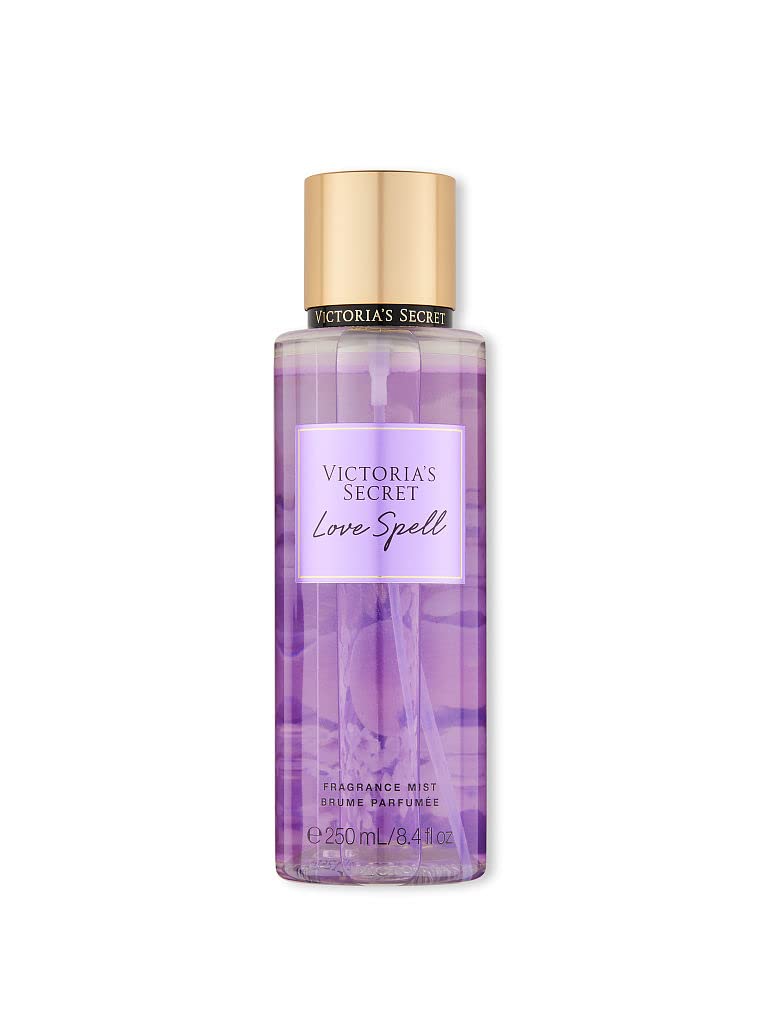 Victoria's Secret Love Spell bottle pour, ideal for daily refreshment.