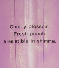Victoria's Secret Love Spell Shimmer Mist spray capturing a light mood-boosting fragrance for daily wear.