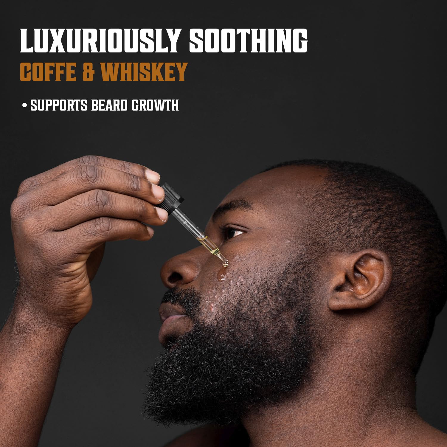 Viking Revolution Coffee Whiskey Beard Oil being used to style facial hair