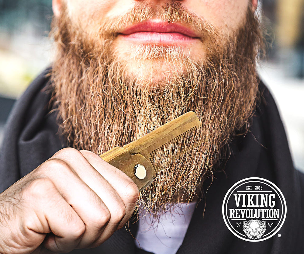 Viking Revolution green-sandalwood folding-beard-comb close-up shows smooth wood texture.