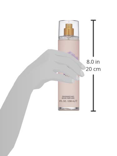 Vince Camuto Fiori spray application capturing a light even distribution for easy fragrance