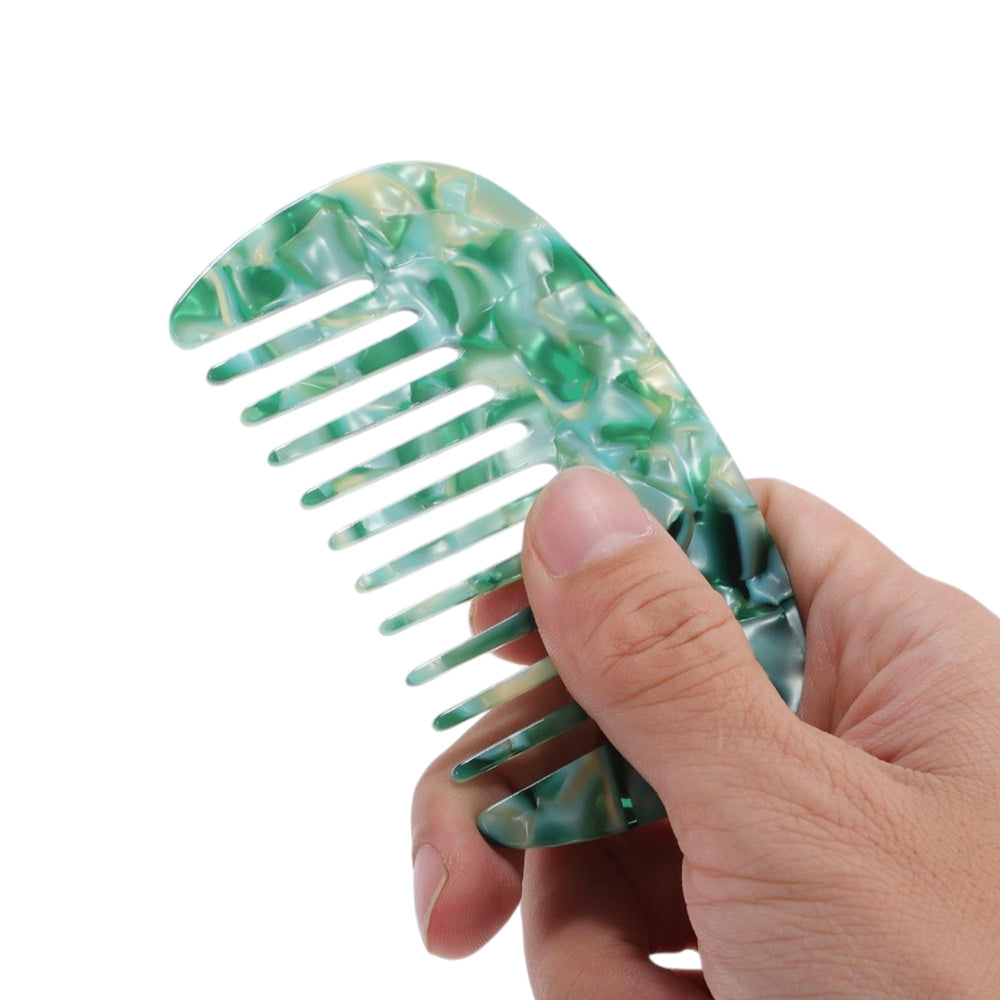 VOCOSTE detangling comb used on wet hair to reduce knots and breakage.