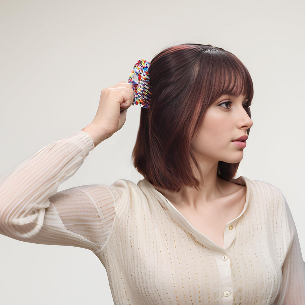 VOCOSTE pocket-size travel comb fits in a purse for quick touch-ups.
