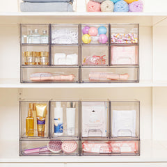Vtopmart 2-pack clear stackable drawers with a pulled-out handle for easy access to cosmetics.