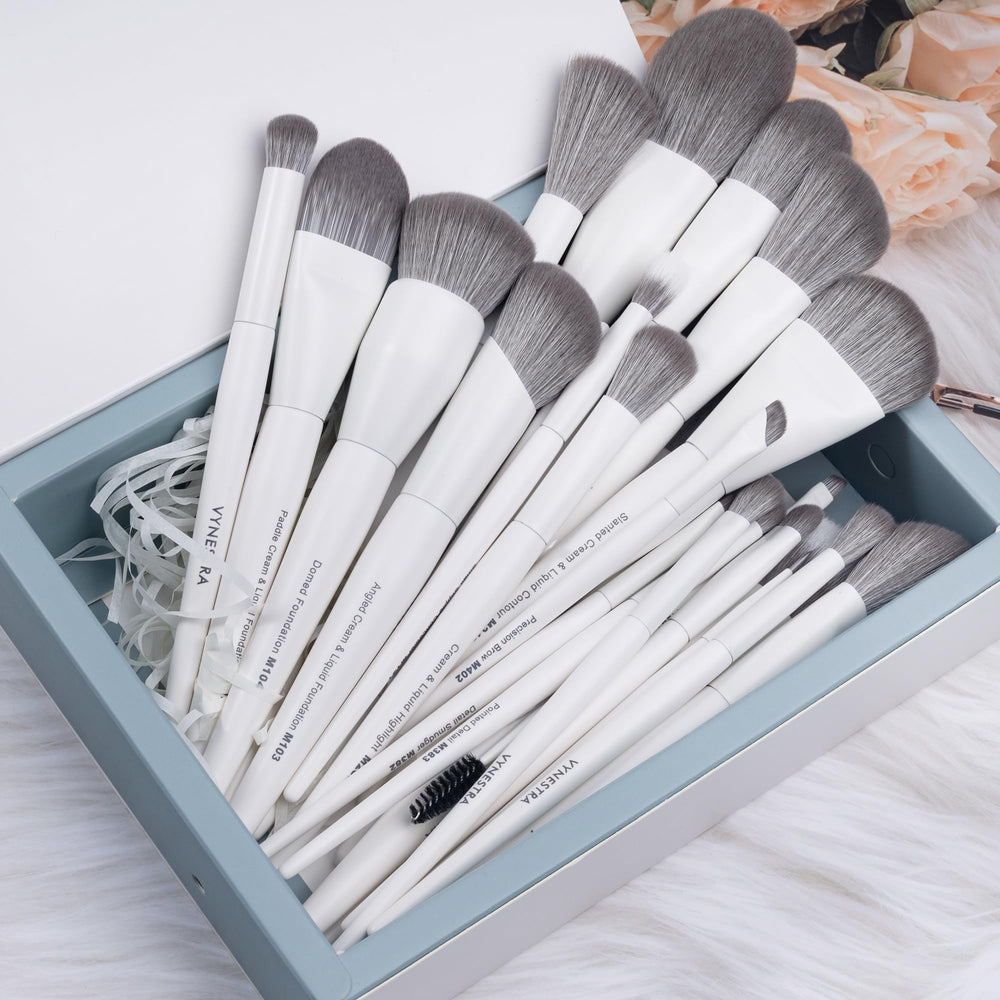 VYNESTRA highlighter brush deposits radiant glow with precise placement