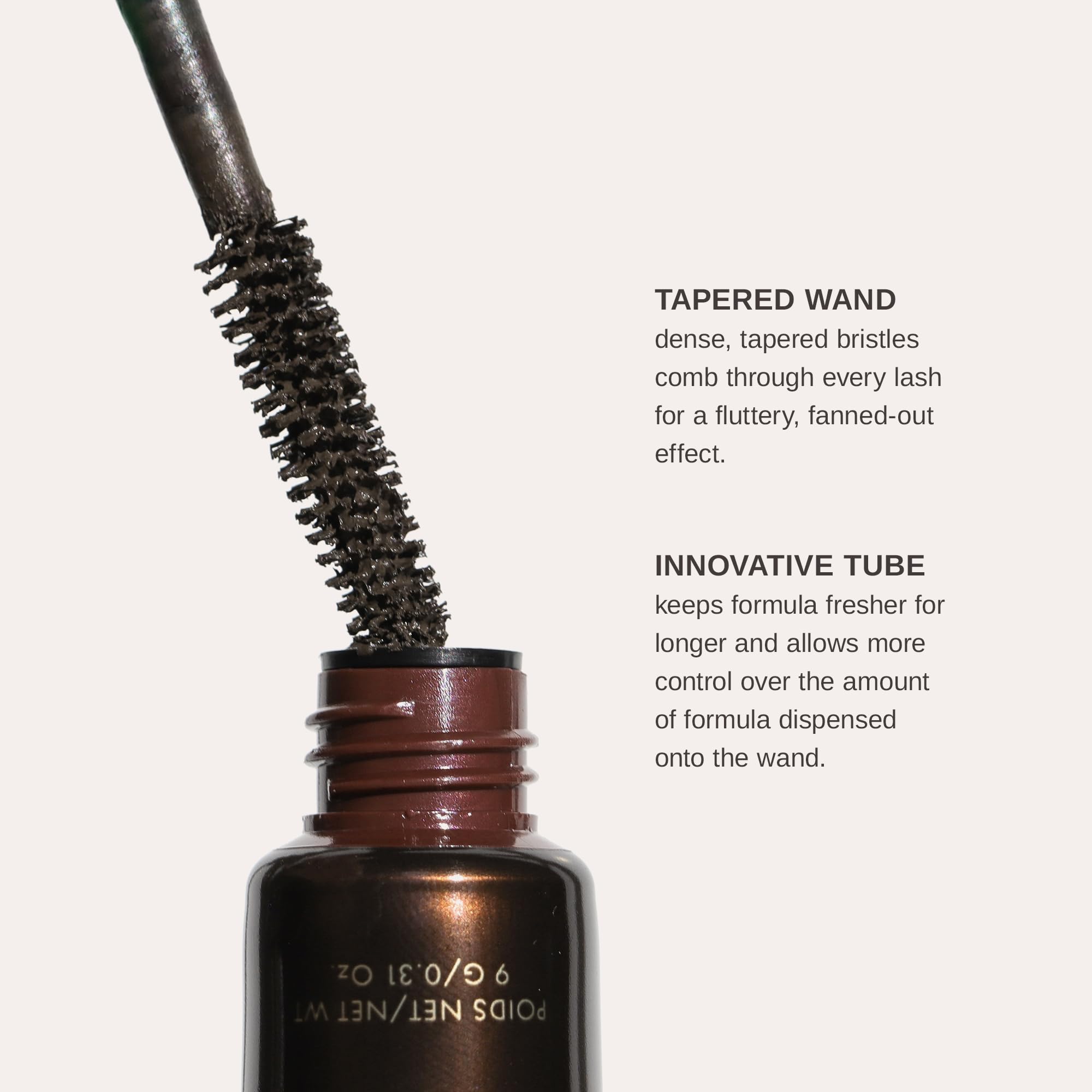 Wander Beauty Mile High Club mascara tube packaging on display with elegant branding.